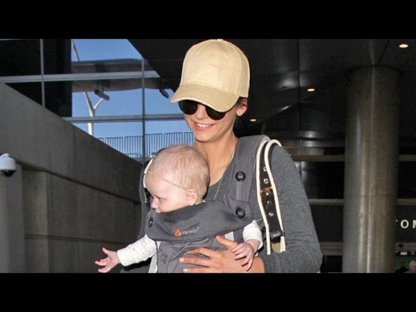 Nina Dobrev Looks Maternal Carrying Baby At LAX After Partying In Cabo With Julianne