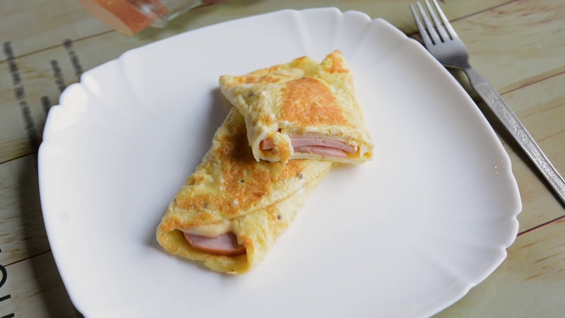 яичные конвертики с сыром и ветчиной. яичные конвертики с сыром и ветчиной. блины с яичницей. яичные конвертики с сыром и ветчиной. конвертик из омлета с сыром.